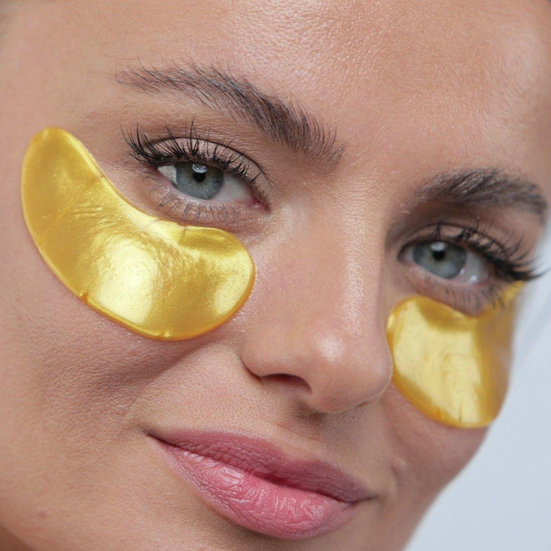 Gold eye mask on face